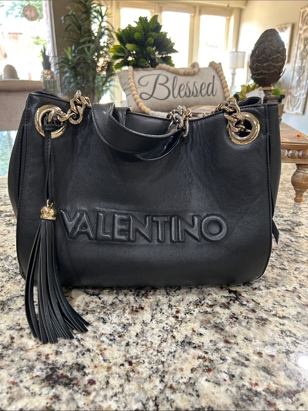 Valentino Black Leather Shoulder Bag with Gold Hardware and Tassel.